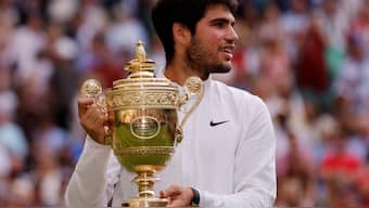 Spain's Carlos Alcaraz with the Wimbledon men's singles trophy after his triumph in 2023. Reuters