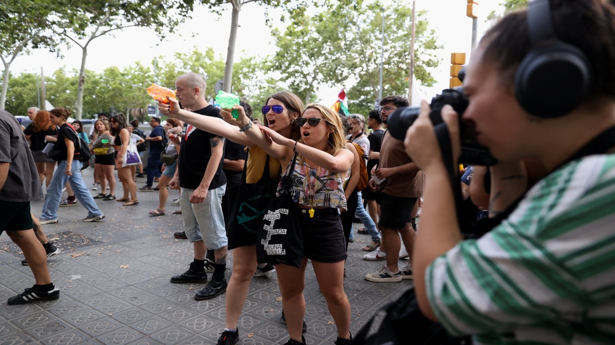 Protesters shoot water from water guns at tourists during a protest against mass tourism in Barcelona, Spain, July 6, 2024. Reuters Protesters shoot water from water guns at tourists during a protest against mass tourism in Barcelona, Spain, July 6, 2024. Reuters
