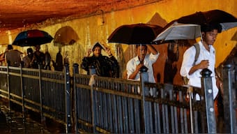 People walk in a waterlogged subway after heavy rains in Mumbai, India, July 8, 2024. REUTERS/File