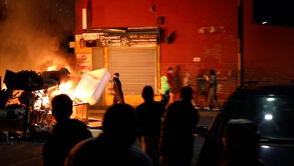 Police cars flipped, bus on fire: What's behind the riots in UK's Leeds?