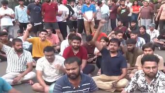 Screengrab from a video where students can be seen protesting over the death of three people in a flooded basement of a coaching centre in Rajendra Nagar. ANI
