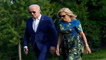 President Joe Biden, left, and first lady Jill Biden walk on the South Lawn of the White House in Washington, Sunday, July 7, 2024, after returning from events in Pennsylvania. AP