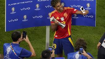 Spain's Lamine Yamal receives the trophy for the best player of the match, at the end of a semifinal match between Spain and France at the Euro 2024. AP