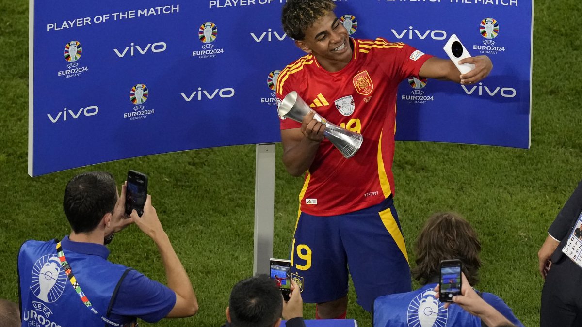 Spain's Lamine Yamal receives the trophy for the best player of the match, at the end of a semifinal match between Spain and France at the Euro 2024. AP Spain's Lamine Yamal receives the trophy for the best player of the match, at the end of a semifinal match between Spain and France at the Euro 2024. AP