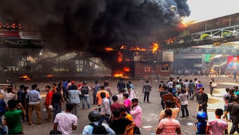 Anti-quota protesters clash with the police in Dhaka. AFP
