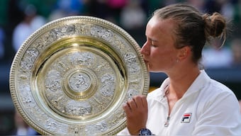 Barbora Krejcikova kisses the Wimbledon trophy after beating Jasmine Paolini in the final. AP