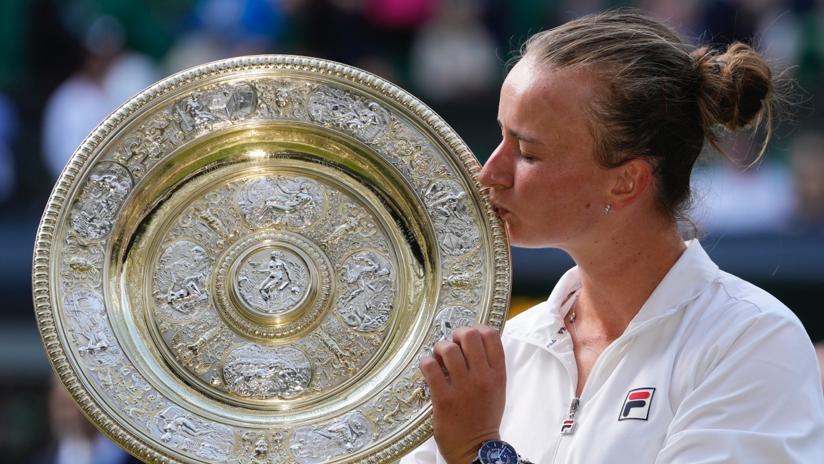 Barbora Krejcikova kisses the Wimbledon trophy after beating Jasmine Paolini in the final. AP Barbora Krejcikova kisses the Wimbledon trophy after beating Jasmine Paolini in the final. AP