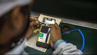 Representative image of a technician making a smartphone. Image Credit: Reuters