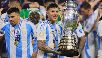 Chelsea and Argentina midfielder Enzo Fernandez poses with the trophy after 'La Albiceleste' defeated Colombia in the final of the 2024 Copa America in Miami. Reuters