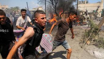 At least 20 people are reported to have been killed in the attack Photograph: Hatem Khaled/Reuters
