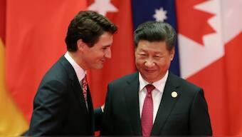 Chinese President Xi Jinping shakes hands with Prime Minister Justin Trudeau. File Photo- AP