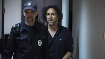 French citizen Laurent Vinatier, right, is escorted into a cage in a courtroom in the Zamoskvoretsky District Court in Moscow, Russia on Friday, June 7, 2024. File Photo- AP