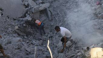 Palestinians search for bodies and survivors in the rubble of a residential building destroyed in an Israeli airstrike in Khan Younis, Gaza Strip, Wednesday, July 3, 2024. File Photo- AP