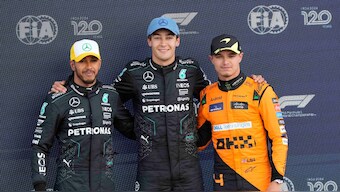 (Left to right) Lewis Hamilton, George Russell and Lando Norris pose together after securing the top three at their home race. AP