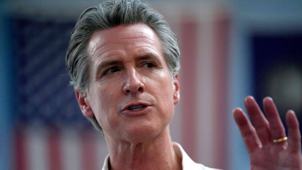 California Governor Gavin Newsom greets people, July 8, 2024, near the Common Man Roadside Market and Deli, in Hooksett. AP