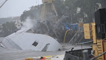 The heavily tilted INS Brahmaputra at the naval dockyard in Mumbai
