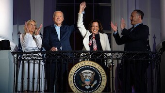 US First lady Jill Biden, left, and second gentleman Douglass Emhoff, right, watch as US President Joe Biden, center left, raises the hand of Vice President Kamala Harris as they view the Independence Day firework display over the National Mall from the balcony of the White House, July 4, 2024, in Washington. File Image/AP