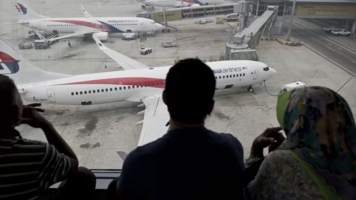 Passengers watch Malaysia Airlines planes on the tarmac at Kuala Lumpur International Airport (KLIA). Source: AFP/Representational Image. Passengers watch Malaysia Airlines planes on the tarmac at Kuala Lumpur International Airport (KLIA). Source: AFP/Representational Image.