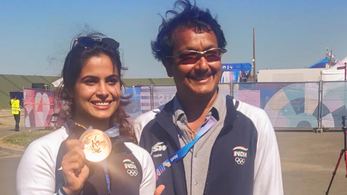Shooter Manu Bhaker poses with her Paris Olympics bronze medal alongside coach Jaspal Rana. PTI Shooter Manu Bhaker poses with her Paris Olympics bronze medal alongside coach Jaspal Rana. PTI