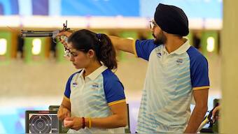 India's Manu Bhaker and Sarabjot Singh (right) in action during the 10m air rifle mixed team qualifying round in the Paris Olympics. AP