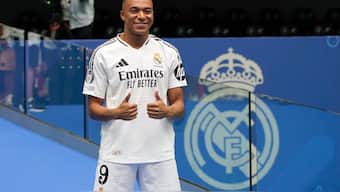 Kylian Mbappe poses for the cameras after being presented to fans as a new Real Madrid player at the Santiago Bernabeu stadium in Madrid. AP