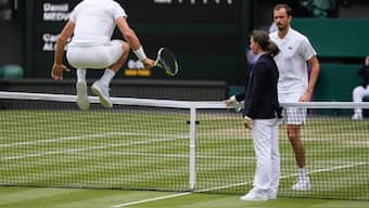 Carlos Alcaraz and Daniil Medvedev at the net ahead of their Wimbledon semi-final. AP