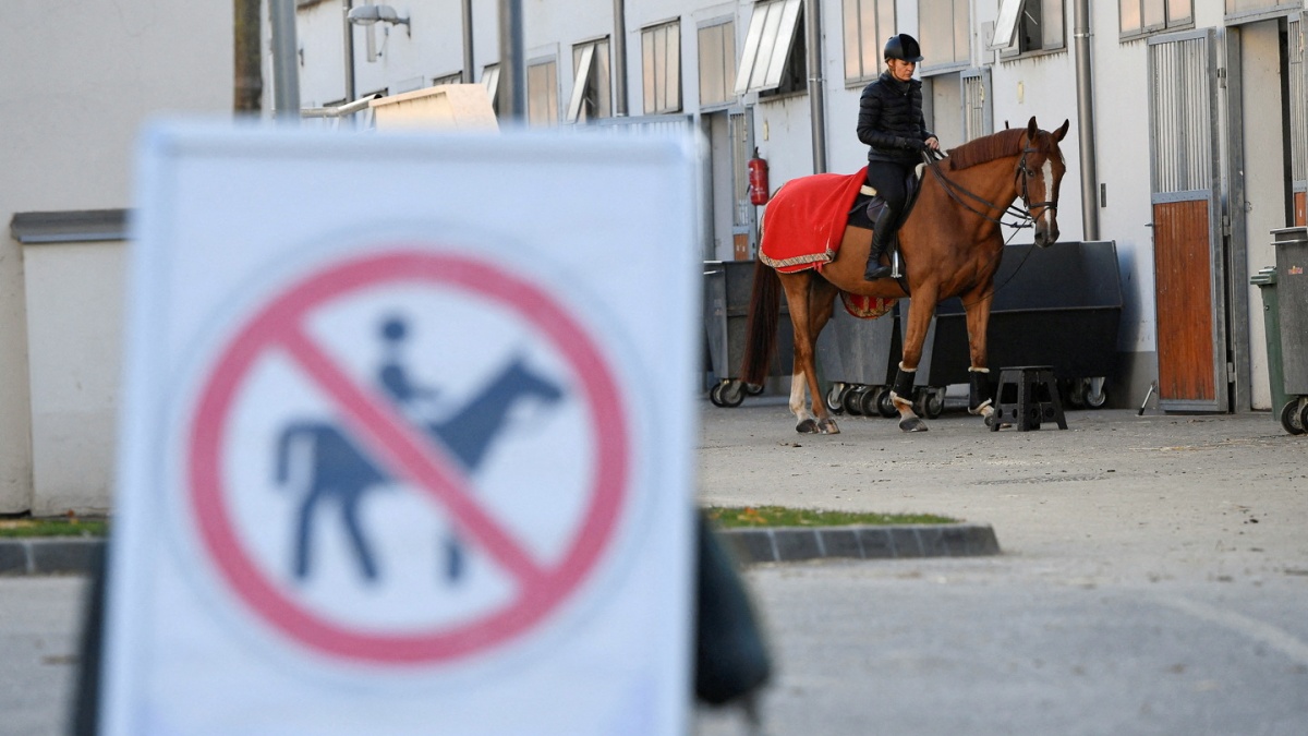 FILE PHOTO: A rider with her horse are seen next to a no riding zone sign during a news conference about keeping horse riding in the modern pentathlon program. Reuters FILE PHOTO: A rider with her horse are seen next to a no riding zone sign during a news conference about keeping horse riding in the modern pentathlon program. Reuters