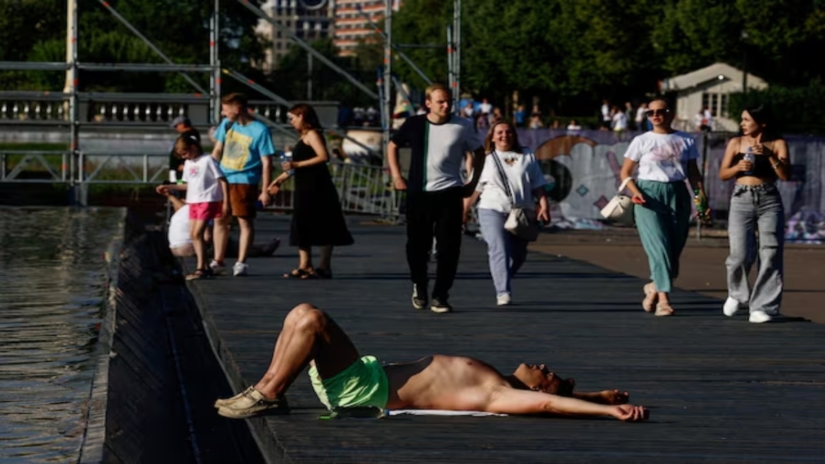 A man lies near a fountain in a park as hot wave grips Moscow, Russia on July 2, 2024. Reuters A man lies near a fountain in a park as hot wave grips Moscow, Russia on July 2, 2024. Reuters