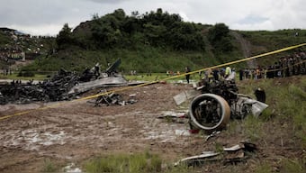 Emergency personnel work at the accident site of a Saurya Airlines plane that caught fire after skidding off the runway while taking off at Tribhuvan International Airport, in Kathmandu, Nepal July 24, 2024. Source: REUTERS.