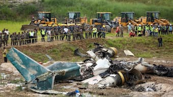 Nepal army personnel cordon off a plane crash site at Tribhuvan International Airport in Kathmandu, Nepal. AP