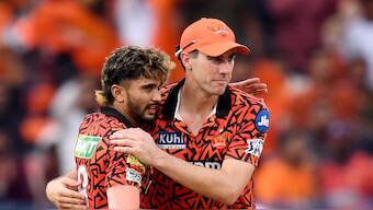 Sunrisers Hyderabad batting all-rounder Nitish Reddy and skipper Pat Cummins in action during their home game against Punjab Kings in IPL 2024. AFP