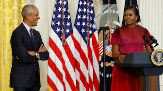 Former US President Barack Obama listens as former first lady Michelle Obama speaks during the unveiling of their official White House portraits, in the East Room of the White House, in Washington, US, September, 7, 2022. File Image/Reuters