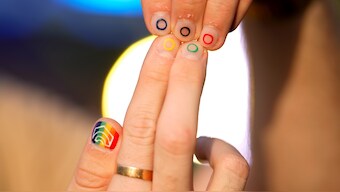 Jeremy Goupille shows his nails painted with the rainbow colors and the Olympic rings at the opening of Pride House during the 2024 Summer Olympics in Paris. AP