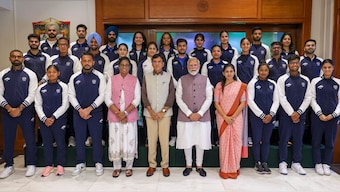Prime Minister Narendra Modi, Spirts Minister Mansukh Mandaviya and IOA president PT Usha poses with some members of the Indian contingent heading to the Paris Olympics. PTI 