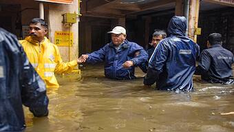 Locals being evacuated due to heavy waterlogging following incessant rains, in Pune district, Thursday, July 25, 2024. PTI