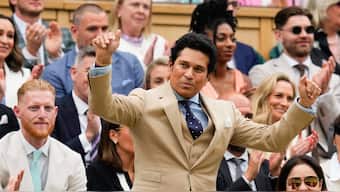 Indian batting legend Sachin Tendulkar acknowledges the crowd at the Wimbledon's Centre Court while witnessing the men's singles third-round meeting between Alexander Zverev and Cam Norrie. AP