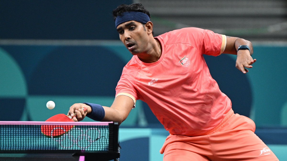 Sharath Kamal in action against Deni Kozul of Slovenia during the Men Singles Round of 64 of the Table Tennis competition at the Paris 2024 Olympics. PTI Sharath Kamal in action against Deni Kozul of Slovenia during the Men Singles Round of 64 of the Table Tennis competition at the Paris 2024 Olympics. PTI