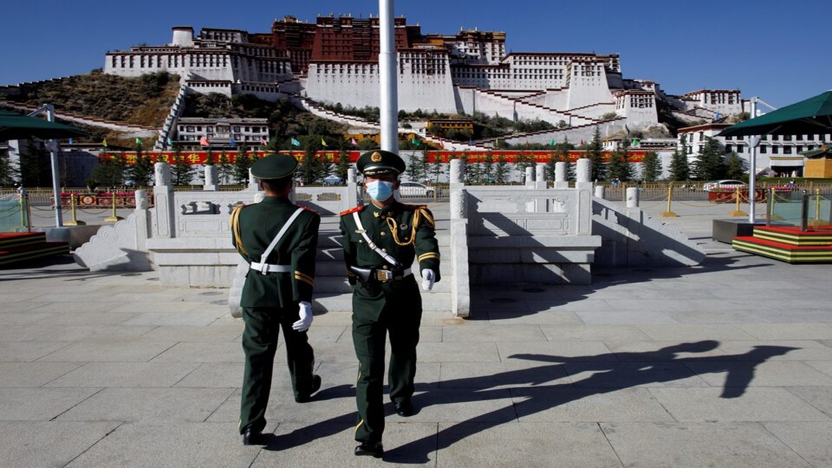 Paramilitary police officers swap positions during a change of guard in front of Potala Palace in Lhasa, during a government-organised tour of the Tibet Autonomous Region, China, October 15, 2020. REUTERS/Thomas Peter/File Photo Paramilitary police officers swap positions during a change of guard in front of Potala Palace in Lhasa, during a government-organised tour of the Tibet Autonomous Region, China, October 15, 2020. REUTERS/Thomas Peter/File Photo