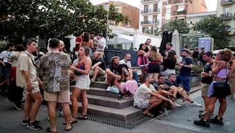 Tourists and residents drink on a street in Gracia neighbourhood during a heatwave of the summer, in Barcelona, Spain. Reuters File