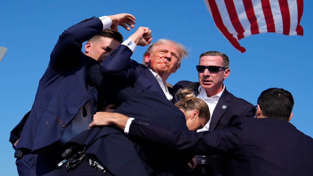 Republican presidential candidate former President Donald Trump is surround by U.S. Secret Service agents at a campaign rally, Saturday, July 13, 2024, in Butler, Pa. AP Republican presidential candidate former President Donald Trump is surround by U.S. Secret Service agents at a campaign rally, Saturday, July 13, 2024, in Butler, Pa. AP