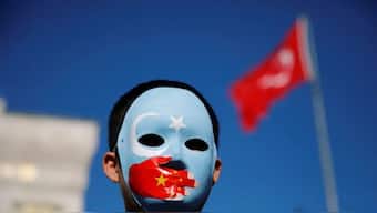  An ethnic Uighur boy wears a mask during a protest against China in Istanbul, Turkey, December 14, 2019. Image: REUTERS
