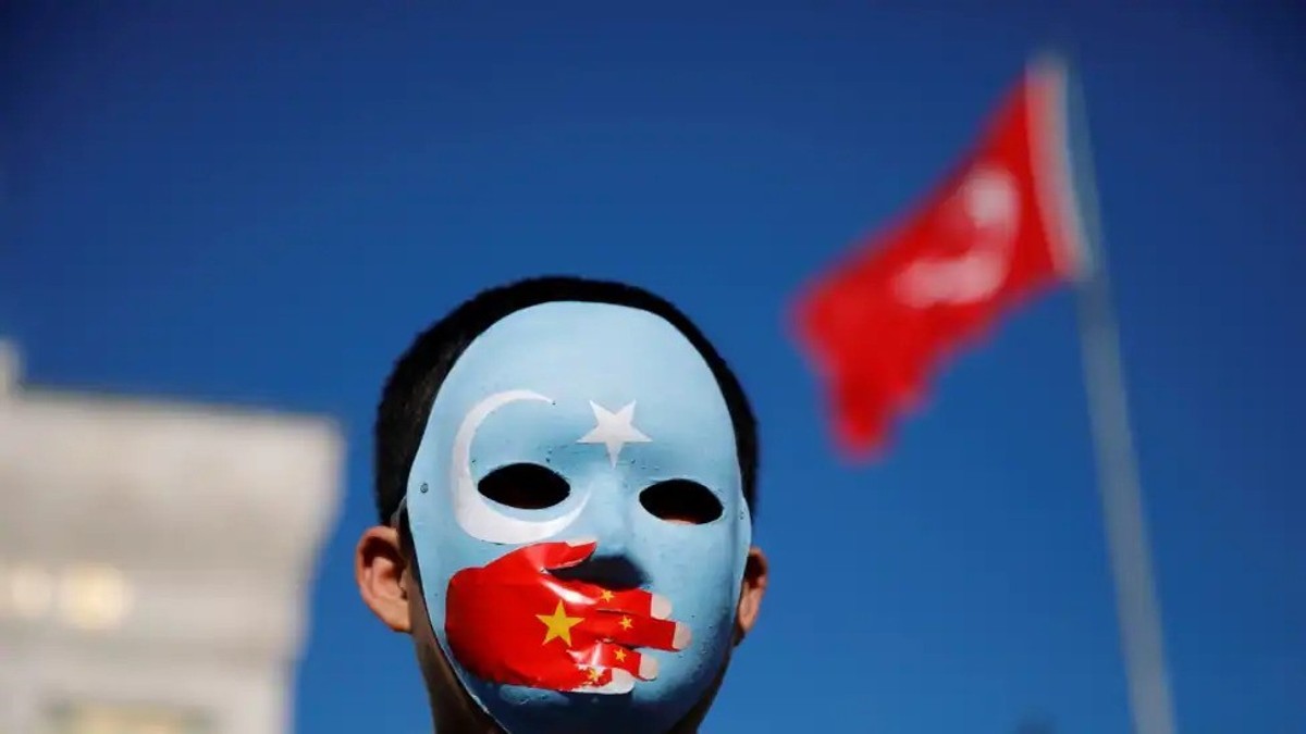 An ethnic Uighur boy wears a mask during a protest against China in Istanbul, Turkey, December 14, 2019. Image: REUTERS An ethnic Uighur boy wears a mask during a protest against China in Istanbul, Turkey, December 14, 2019. Image: REUTERS