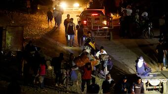 Palestinians, who fled the eastern part of Khan Younis, walk, after they were ordered by Israeli army to evacuate their neighbourhoods, amid Israel-Hamas conflict, in Khan Younis. Reuters