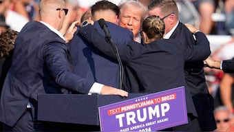 Republican presidential candidate former President Donald Trump is surrounded by U.S. Secret Service at a campaign event in Butler, Pennsylvania, on July 13, 2024. AP