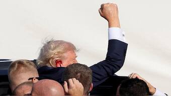 Donald Trump assisted by his secuity officials after the assasination attempt. Reuters