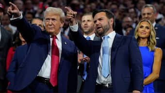 Donald Trump and vice presidential nominee J.D. Vance gesture during Day 1 of the RNC in Milwaukee, July 15. REUTERS