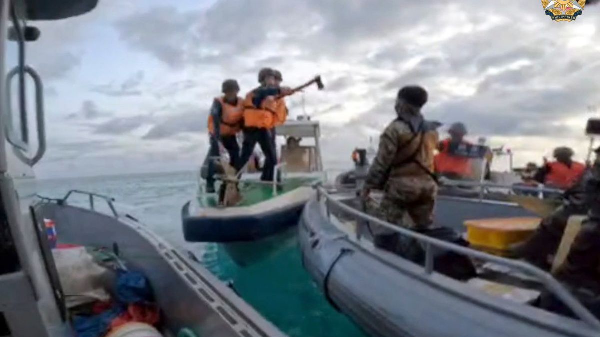 In this handout image provided by Armed Forces of the Philippines, Chinese Coast Guard hold knives and machetes as they approach Philippine troops on a resupply mission in the Second Thomas Shoal at the disputed South China Sea on June 17, 2024. AP In this handout image provided by Armed Forces of the Philippines, Chinese Coast Guard hold knives and machetes as they approach Philippine troops on a resupply mission in the Second Thomas Shoal at the disputed South China Sea on June 17, 2024. AP