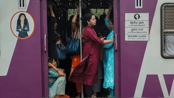 Women travel in the ladies compartment of a local train in Mumbai, India, July 23, 2024. AP