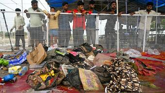 Men look at the site of a stampede at Hathras in Uttar Pradesh on July 3, 2024. AFP