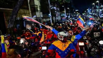 Supporters of Venezuela's President Nicolas Maduro celebrate after he won third term in the presidential election, in Caracas, Venezuela. Reuters